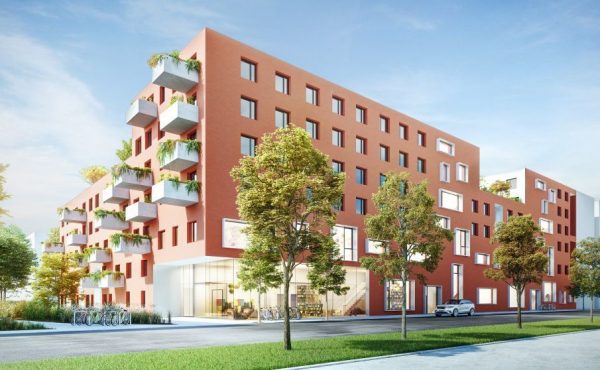 Moderne Wohnanlage mit Balkonen, umgeben von Bäumen an einem sonnigen Tag.