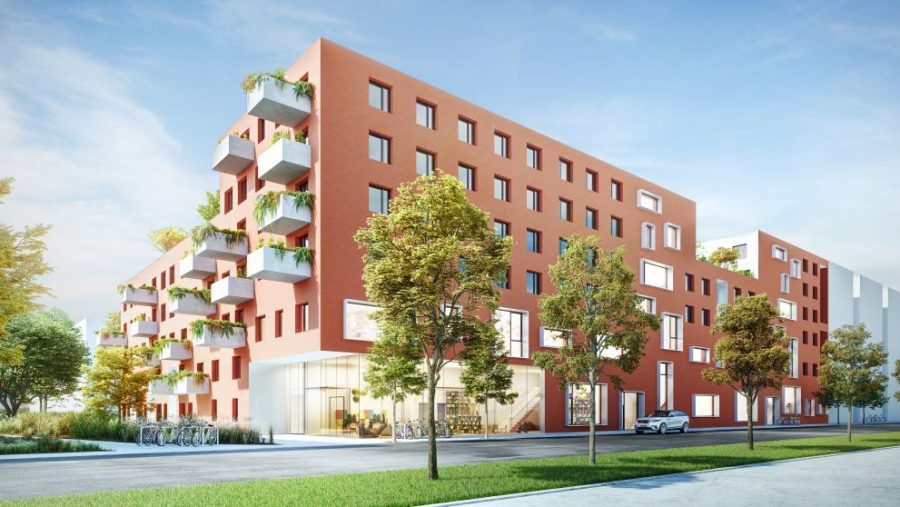 Moderne Wohnanlage mit Balkonen, umgeben von Bäumen an einem sonnigen Tag.