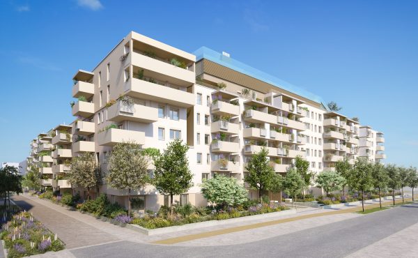 Moderne Wohnanlage mit Balkonen und Grünflächen bei klarem Himmel.