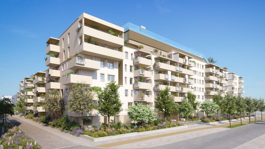 Moderne Wohnanlage mit Balkonen und Grünflächen bei klarem Himmel.