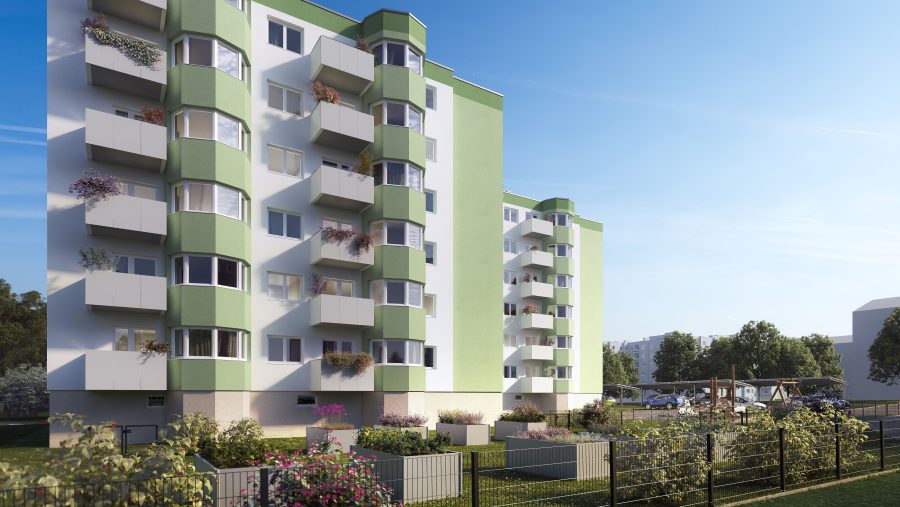 Moderne Wohnhausfassade mit Balkonen und Garten, sonniger Himmel im Hintergrund.