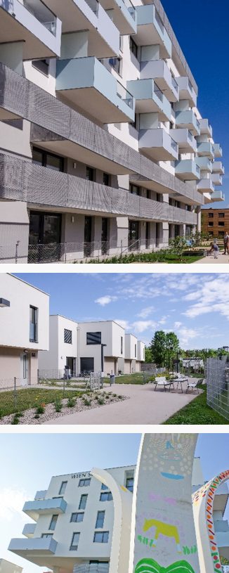 Referenz "In der Wiesen Süd" Mehrfamilienhäuser mit modernen Fassaden und Gartenanlagen an einem sonnigen Tag.