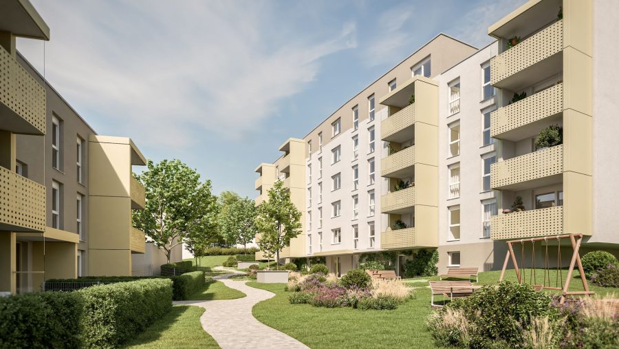 Moderne Wohnanlage mit gepflegtem Garten und Spielplatzweg in Sonnenschein.