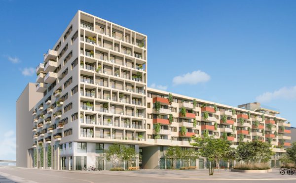 Moderne Apartmentgebäude mit Balkonen und Pflanzen bei klarem Himmel.