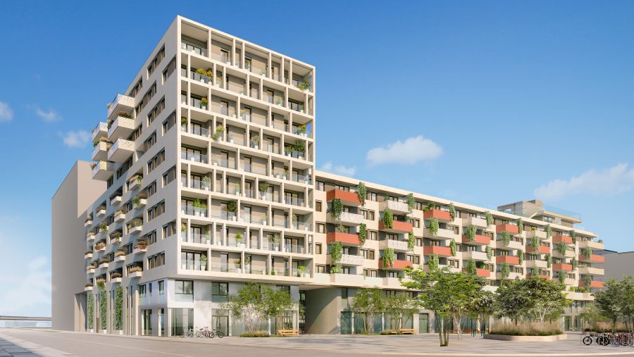 Moderne Apartmentgebäude mit Balkonen und Pflanzen bei klarem Himmel.